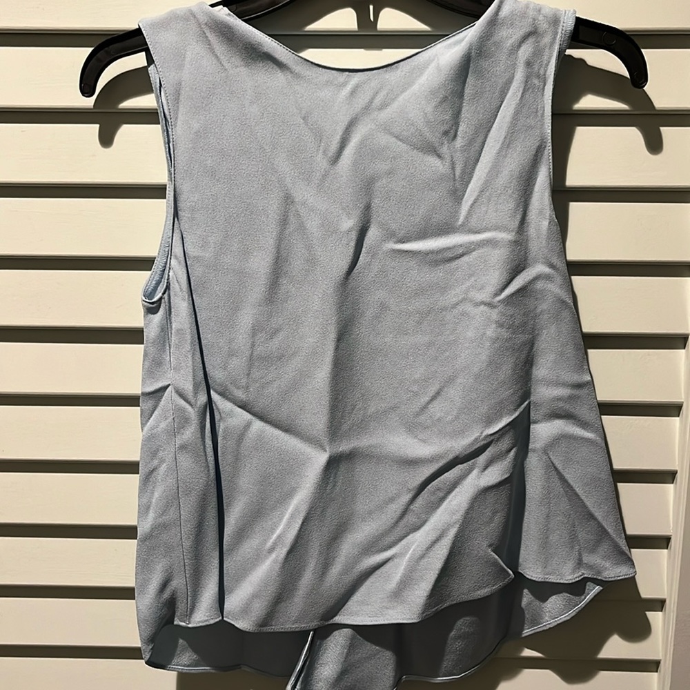 REBECCA MINKOFF. Sleeveless low back blouse in a sky blue color. Size xxs. NWT